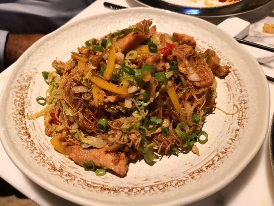 Chef Preparing Dish at Kim's Singapore Seafood Top Restaurants in Dubai