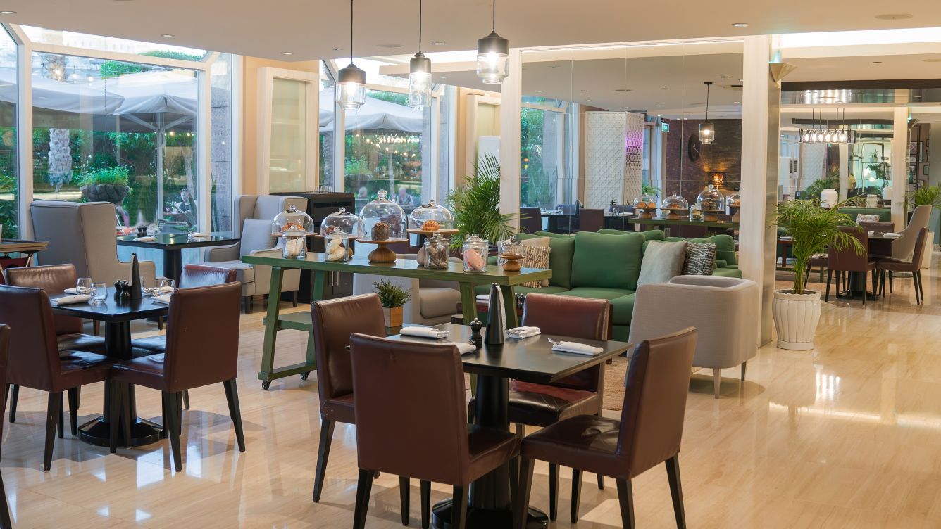 Chef preparing a dish at The Croft Top Restaurants in Dubai